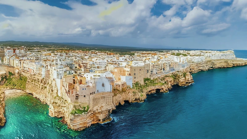 Illustrated view of Polignano a Mare houses on cliffs above geometric sea.